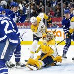 
              Toronto Maple Leafs' Auston Matthews, second from left, watches as his shot hits the Nashville Predators' goal post during the second period of an NHL hockey game in Toronto, Tuesday, Nov. 16, 2021. (Chris Young/The Canadian Press via AP)
            