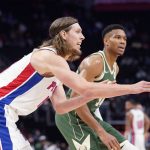 
              Detroit Pistons forward Kelly Olynyk passes during the first half of an NBA basketball game against the Milwaukee Bucks, Tuesday, Nov. 2, 2021, in Detroit. (AP Photo/Carlos Osorio)
            