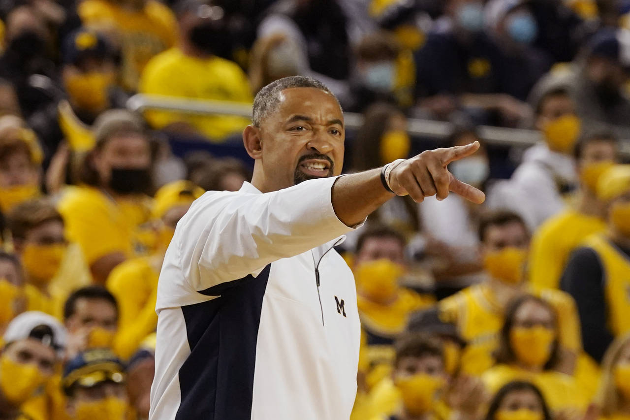 Michigan head coach Juwan Howard points from the sideline during the first half of an NCAA college ...