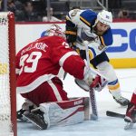 
              Detroit Red Wings goaltender Alex Nedeljkovic (39) stops a St. Louis Blues center Ryan O'Reilly (90) shot in the third period of an NHL hockey game Wednesday, Nov. 24, 2021, in Detroit. (AP Photo/Paul Sancya)
            