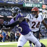 
              Baltimore Ravens wide receiver Marquise Brown (5) catches a touchdown pass in front of Cincinnati Bengals safety Vonn Bell (24) during the second half of an NFL football game, Sunday, Oct. 24, 2021, in Baltimore. (AP Photo/Nick Wass)
            