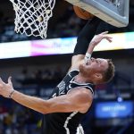 
              Brooklyn Nets forward Blake Griffin is blocked by New Orleans Pelicans center Jonas Valanciunas as he goes to the basket in the first half of an NBA basketball game in New Orleans, Friday, Nov. 12, 2021. (AP Photo/Gerald Herbert)
            