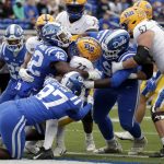 
              Duke linebacker Shaka Heyward (42), defensive end Caleb Oppan (97) and defensive tackle Gary Smith III (58) tackle Pittsburgh running back Vincent Davis (22) for a safety during the first half of an NCAA college football game Saturday, Nov. 6, 2021, in Durham, N.C. (AP Photo/Chris Seward)
            