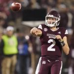 
              Mississippi State quarterback Will Rogers (2) passes against Mississippi during the first half of an NCAA college football game, Thursday, Nov. 25, 2021, in Starkville, Miss. (AP Photo/Rogelio V. Solis)
            