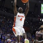 
              Florida forward Anthony Duruji (4) dunks against Troy during the first half of an NCAA college basketball game Sunday, Nov. 28, 2021, in Gainesville, Fla. (AP Photo/Matt Stamey)
            