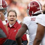 
              Alabama head coach Nick Saban talks with players in a time out during the first half of an NCAA college football game against Auburn Saturday, Nov. 27, 2021, in Auburn, Ala. (AP Photo/Butch Dill)
            