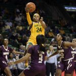 
              Baylor guard Sarah Andrews scores over Texas State guard Kennedy Taylor in the second half of an NCAA college basketball game, Tuesday, Nov. 9, 2021, in Waco, Texas. (Rod Aydelotte/Waco Tribune-Herald via AP)
            