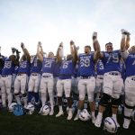 
              Air Force players since the school song after the second half of an NCAA college football game against UNLV Friday, Nov. 26, 2021, at Air Force Academy, Colo. Air Force won 48-14. (AP Photo/David Zalubowski)
            