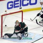 
              Minnesota Wild goalie Cam Talbot, center, gives up a goal to San Jose Sharks' Mario Ferraro which was set up by San Jose Sharks' Logan Couture, top right, during the first period of an NHL hockey game Tuesday, Nov. 16, 2021, in St. Paul, Minn. (AP Photo/Jim Mone)
            