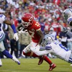 
              Kansas City Chiefs wide receiver Mecole Hardman (17) runs with the ball as Dallas Cowboys safety Donovan Wilson (6) and linebacker Keanu Neal (42) defend during the first half of an NFL football game Sunday, Nov. 21, 2021, in Kansas City, Mo. (AP Photo/Ed Zurga)
            