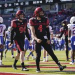 
              San Diego State quarterback Jordon Brookshire (4) celebrates after scoring a touchdown during the second half of an NCAA college football game against the Boise State in Carson, Calif., Friday, Nov. 26, 2021. (AP Photo/Ashley Landis)
            