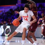 
              In this photo provided by Bahamas Visual Services, Syracuse center Jesse Edwards (14) controls the ball against Arizona State during an NCAA college basketball game at Paradise Island, Bahamas, Thursday, Nov. 25, 2021. (Tim Aylen/Bahamas Visual Services via AP)
            
