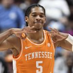 
              Tennessee's Zakai Zeigler (5) gestures after making a three-point basket in the second half of an NCAA college basketball game against North Carolina, Sunday, Nov. 21, 2021, in Uncasville, Conn. (AP Photo/Jessica Hill)
            