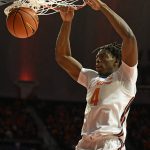 
              Illinois' Omar Payne dunks the ball during the first half of an NCAA college basketball game against Arkansas State Friday, Nov. 12, 2021, in Champaign, Ill. (AP Photo/Michael Allio)
            