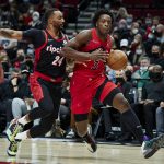 
              Toronto Raptors forward OG Anunoby, right, drives to the basket as Portland Trail Blazers forward Norman Powell defends during the first half of an NBA basketball game in Portland, Ore., Monday, Nov. 15, 2021. (AP Photo/Craig Mitchelldyer)
            