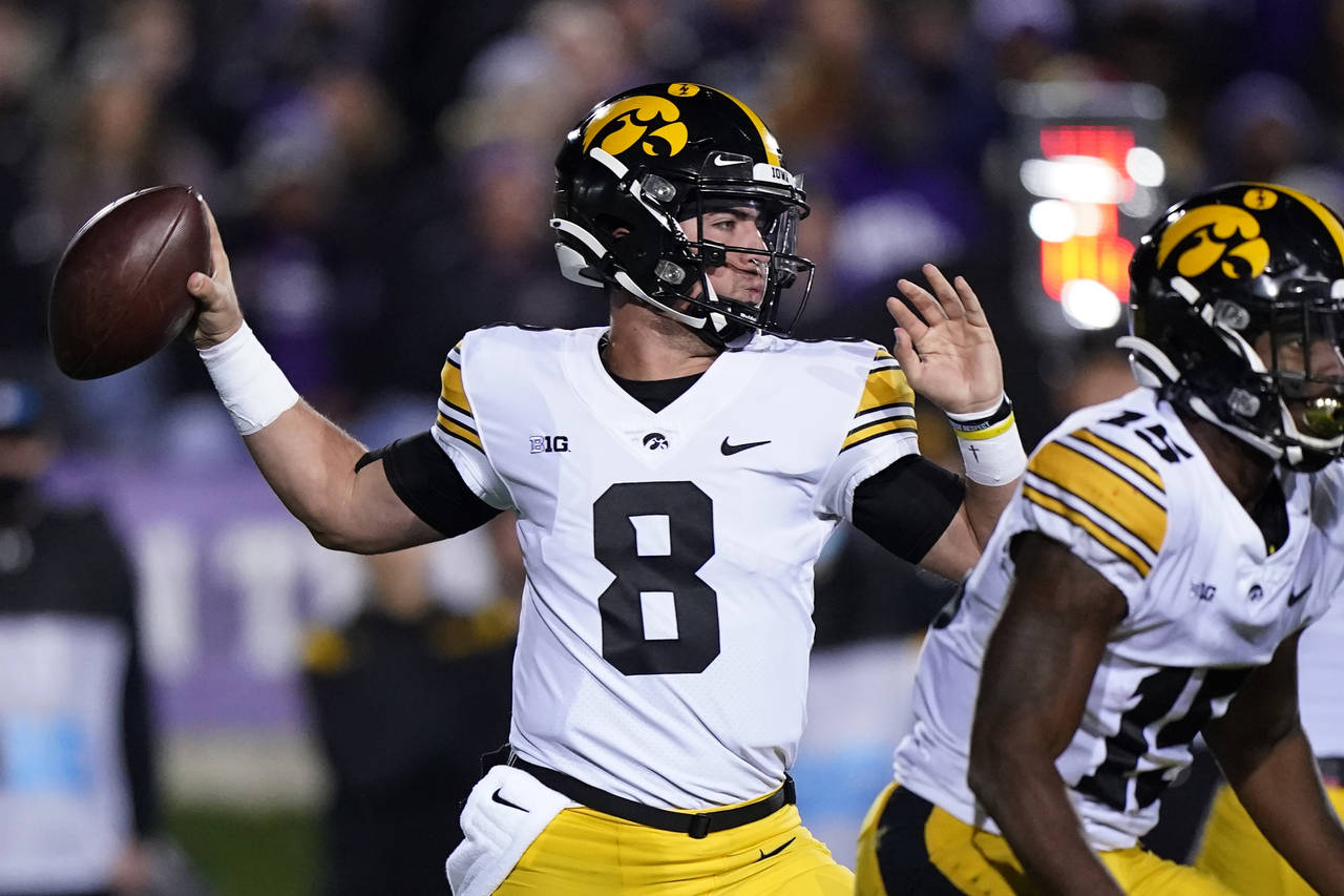 Iowa quarterback Alex Padilla looks to pass against Northwestern during the first half of an NCAA c...