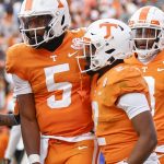 
              Tennessee running back Jabari Small (2) is congratulated by quarterback Hendon Hooker (5) after scoring a touchdown during the first half of an NCAA college football game against Vanderbilt Saturday, Nov. 27, 2021, in Knoxville, Tenn. (AP Photo/Wade Payne)
            