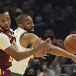 
              Boston Celtics' Jabari Parker, right, and Cleveland Cavaliers' Darius Garland battle for a rebound in the first half of an NBA basketball game, Saturday, Nov. 13, 2021, in Cleveland. (AP Photo/Tony Dejak)
            