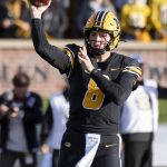 
              Missouri quarterback Connor Bazelak throws a pass during the first quarter of an NCAA college football game against South Carolina, Saturday, Nov. 13, 2021, in Columbia, Mo. (AP Photo/L.G. Patterson)
            