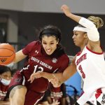 
              South Carolina's Brea Beal (12) tries to drive the ball around North Carolina State's Kai Crutchfield (3) during the second half of an NCAA college basketball game, Tuesday, Nov. 9, 2021 in Raleigh, N.C. (AP Photo/Karl B. DeBlaker)
            
