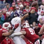 
              Northwestern quarterback Andrew Marty throws a pass as he's hit bt Wisconsin's Jack Sanborn and Nick Herbig during the first half of an NCAA college football game Saturday, Nov. 13, 2021, in Madison, Wis. (AP Photo/Morry Gash)
            