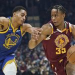 
              Cleveland Cavaliers' Isaac Okoro (35) drives against Golden State Warriors' Jordan Poole (3) in the first half of an NBA basketball game, Thursday, Nov. 18, 2021, in Cleveland. (AP Photo/Tony Dejak)
            