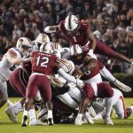
              South Carolina defensive end Kingsley Enagbare (1) leaps onto a pile of players during the first half of an NCAA college football game against Auburn, Saturday, Nov. 20, 2021, in Columbia, S.C. (AP Photo/Sean Rayford)
            