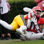 
              Georgia wide receiver Arian Smith (11) makes a catch for a touchdown as Missouri defensive back Jaylon Carlies (1) defends in the first half of an NCAA college football game Saturday, Nov. 6, 2021, in Athens, Ga.. (AP Photo/John Bazemore)
            