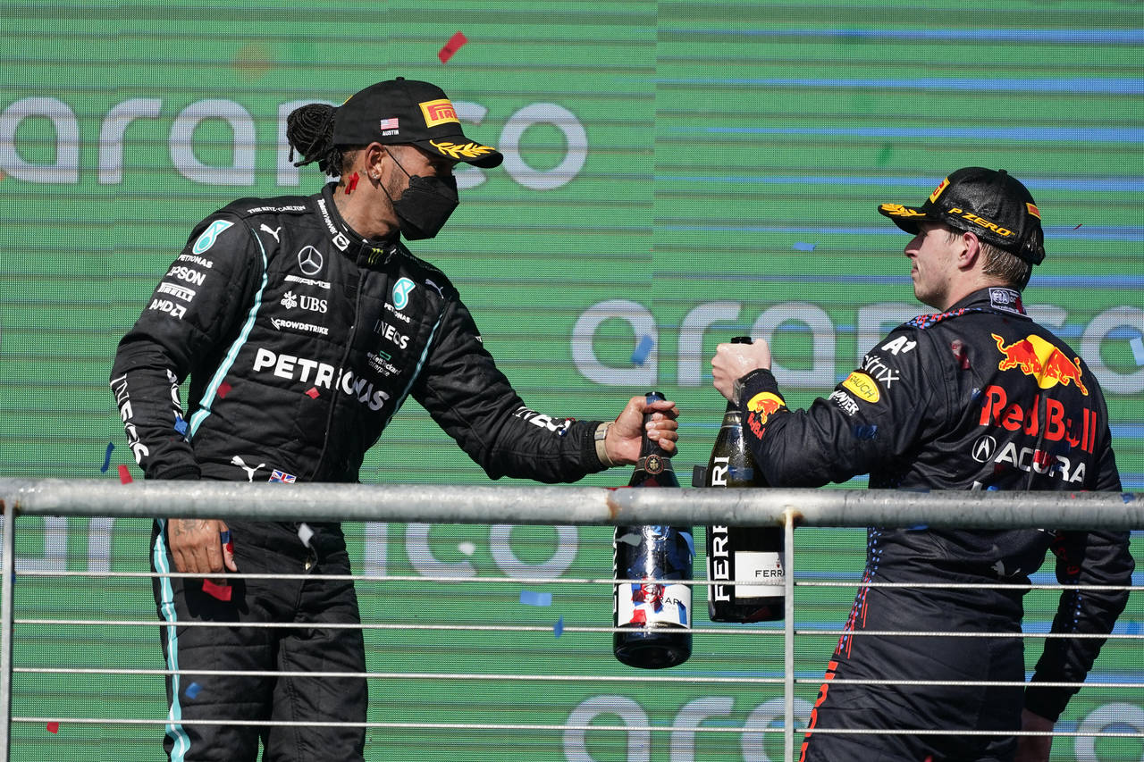 Red Bull driver Max Verstappen, of the Netherlands, and Mercedes driver Lewis Hamilton, of Britain,...