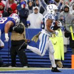 
              Indianapolis Colts running back Jonathan Taylor (28) scores past Buffalo Bills outside linebacker Matt Milano (58) during the second half of an NFL football game in Orchard Park, N.Y., Sunday, Nov. 21, 2021. (AP Photo/Jeffrey T. Barnes)
            