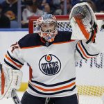 
              Edmonton Oilers goaltender Stuart Skinner (74) keeps his eyes on the puck during the first period of an NHL hockey game against the Buffalo Sabres, Friday, Nov. 12, 2021, in Buffalo, N.Y. (AP Photo/Jeffrey T. Barnes)
            
