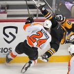 
              Pittsburgh Penguins' Dominik Simon (49) falls after a collision with Philadelphia Flyers' Nick Seeler (24) during the first period of an NHL hockey game in Pittsburgh, Thursday, Nov. 4, 2021. (AP Photo/Gene J. Puskar)
            