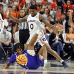 
              Morehead State forward Jaylon Hall (11) goes down with an injury as Auburn guard K.D. Johnson (0) defends during the first half of an NCAA college basketball game Tuesday, Nov. 9, 2021, in Auburn, Ala. (AP Photo/Butch Dill)
            