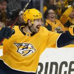 
              Nashville Predators left wing Filip Forsberg celebrates after scoring his third goal against the Columbus Blue Jackets in the second period of an NHL hockey game Tuesday, Nov. 30, 2021, in Nashville, Tenn. (AP Photo/Mark Humphrey)
            