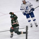 
              Minnesota Wild right wing Ryan Hartman, left, celebrates after scoring the go-ahead goal while skating past Tampa Bay Lightning left wing Boris Katchouk during the third period of an NHL hockey game Sunday, Nov. 28, 2021, in St. Paul, Minn. (AP Photo/Craig Lassig)
            