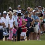 
              Spectators look on at the first hole green during the third round of the LPGA Tour Championship golf tournament, Saturday, Nov. 20, 2021, in Naples, Fla. (AP Photo/Rebecca Blackwell)
            