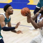
              Pittsburgh's John Hugley, right, shoots as UNC Wilmington's James Baker defends during the second half of an NCAA college basketball game Tuesday, Nov. 16, 2021, in Pittsburgh. Pittsburgh won 59-51. (AP Photo/Keith Srakocic)
            