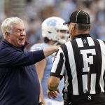 
              North Carolina coach Mack Brown speaks with an official during the second half of the team's NCAA college football game against Florida State in Chapel Hill, N.C., Saturday, Oct. 9, 2021. (AP Photo/Gerry Broome)
            