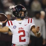 
              Mississippi quarterback Matt Corral (2) passes against Mississippi State during the first half of an NCAA college football game, Thursday, Nov. 25, 2021, in Starkville, Miss. (AP Photo/Rogelio V. Solis)
            