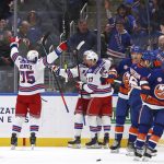 
              New York Rangers center Kevin Rooney (17) celebrates his goal with right wing Ryan Reaves (75) during the second period of an NHL hockey game against the New York Islanders, Wednesday, Nov. 24, 2021, in Elmont, N.Y. (AP Photo/Rich Schultz)
            