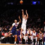 
              Phoenix Suns guard Devin Booker (1) shoots against Brooklyn Nets forward James Johnson (16) during the second half of an NBA basketball game, Saturday, Nov. 27, 2021, in New York. (AP Photo/Jessie Alcheh)
            