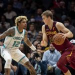 
              Charlotte Hornets guard Kelly Oubre Jr. (12) defends Cleveland Cavaliers forward Lauri Markkanen (24) during the first half of an NBA basketball game, Monday, Nov. 1, 2021, in Charlotte, N.C. (AP Photo/Matt Kelley)
            