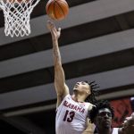 
              Alabama guard Jahvon Quinerly (13) shoots against Oakland during the second half of an NCAA college basketball game, Friday, Nov. 19, 2021, in Tuscaloosa, Ala. (AP Photo/Vasha Hunt)
            