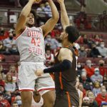 
              Ohio State's Harrison Hookfin, left, shoots over Bowling Green's Chandler Turner during the second half of an NCAA college basketball game Monday, Nov. 15, 2021, in Columbus, Ohio. (AP Photo/Jay LaPrete)
            