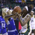 
              Baylor forward NaLyssa Smith, right, is fouled by New Orleans forward Nahja Scott, left, during the first half of an NCAA college basketball game Monday, Nov. 15, 2021, in Waco, Texas. (Rod Aydelotte/Waco Tribune-Herald via AP)
            