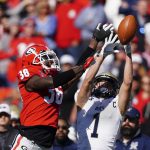 
              Georgia defensive back Latavious Brini (36) breaks up a pass intended for Charleston Southern wide receiver Garris Schwarting (1) in the first half of an NCAA college football game Saturday, Nov. 20, 2021, in Athens, Ga. (AP Photo/John Bazemore)
            
