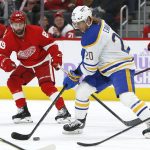 
              Buffalo Sabres center Cody Eakin (20) moves the puck against Detroit Red Wings center Sam Gagner (89) during the second period of an NHL hockey game Saturday, Nov. 27, 2021, in Detroit. (AP Photo/Duane Burleson)
            
