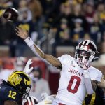 
              Indiana quarterback Donaven McCulley (0) throws a pass during the second quarter of the team's NCAA college football game against Michigan in Ann Arbor, Mich., Saturday, Nov. 6, 2021. (AP Photo/Tony Ding)
            