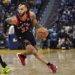 
              Toronto Raptors guard Gary Trent Jr. (33) dribbles up the court against the Golden State Warriors during the first half of an NBA basketball game in San Francisco, Sunday, Nov. 21, 2021. (AP Photo/Jeff Chiu)
            