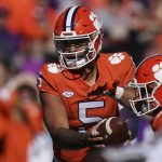
              Clemson quarterback D.J. Uiagalelei (5) hands off to running back Will Shipley during the first half of an NCAA college football game against Wake Forest, Saturday, Nov. 20, 2021, in Clemson, S.C. (AP Photo/Brynn Anderson)
            